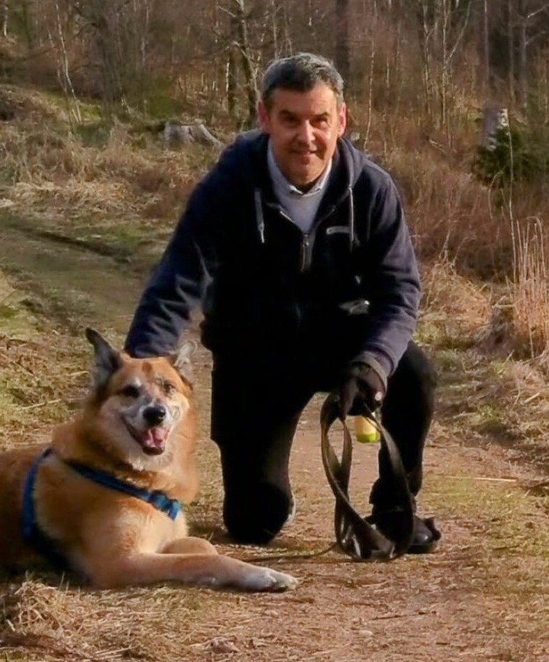 Jean-Jacques and Pako, his dog, on a forest walk.